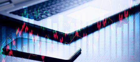 Financial technology concept with devices and charts