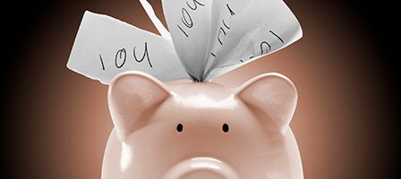 Pink piggy bank holding IOUs