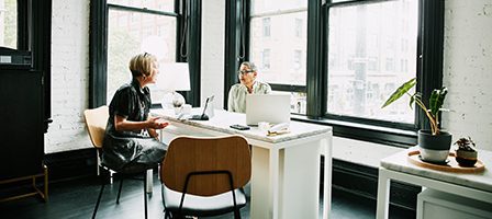 Two people in a bright office