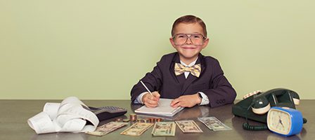 Young accountant with cash and calculator