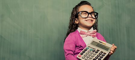 Child with oversized glasses holding calculator