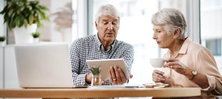 Elderly couple using a tablet together