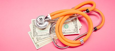 Healthcare costs concept with stethoscope