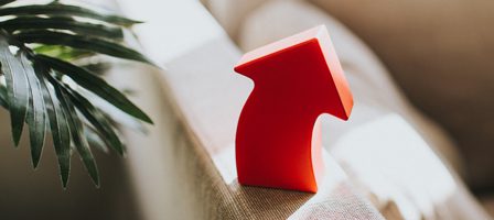 Red arrow decor on couch edge