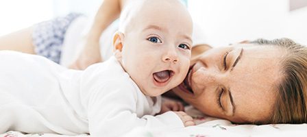 Mother and baby sharing joyful moment