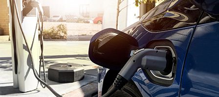 Electric car charging at station