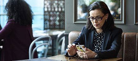 Professional woman focused on phone