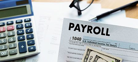 Calculator and payroll paperwork arrangement