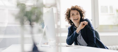 Smiling woman at office desk