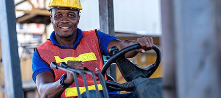 Forklift operator in a hard hat