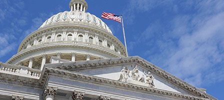 Historic US Capitol architecture and flag