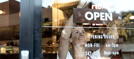 Shop opening hours displayed on door