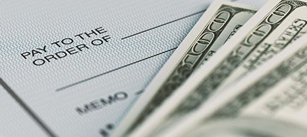 Money and check close-up scene