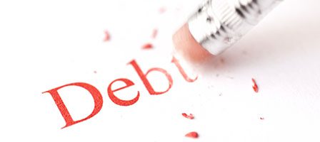 Erasing the word debt with pencil eraser