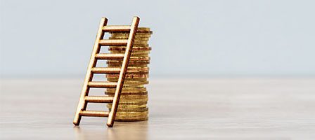 Financial growth concept with ladder and coins