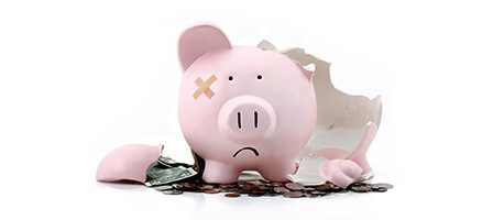 Sad piggy bank with bandage