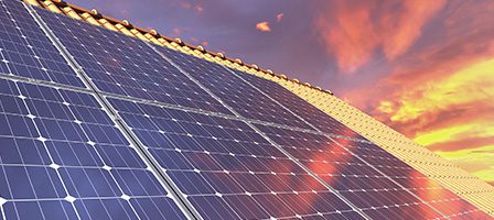 Solar energy panels at dusk sky