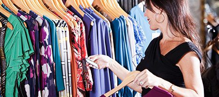 Woman shopping for colorful dresses