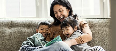 Happy family reading together indoors