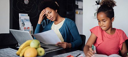 Parent multitasking work and childcare duties
