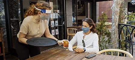 Outdoor dining with safety measures in place