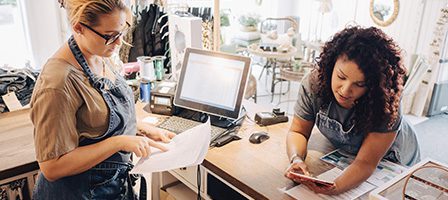 Two women working in a retail store