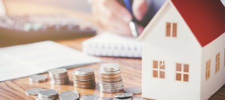 Real estate investment concept with coins