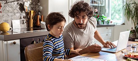 Father helping son with homework