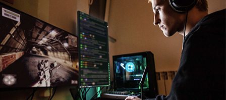 Individual playing video game on PC