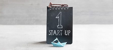 Chalkboard with "1 Start Up" text