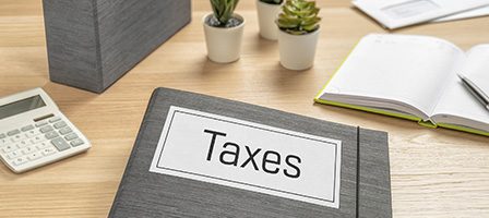 Office desk with tax folder