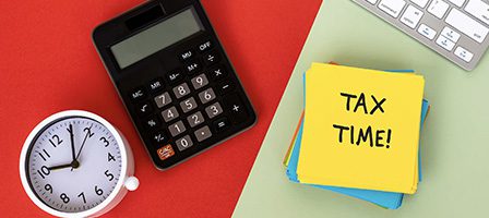 Calculator, notes, and clock for tax season