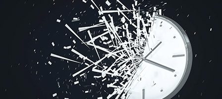 Exploding clock against dark background