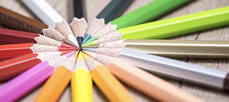 Rainbow pencils fanned out neatly