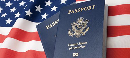 Blue passports on American flag background