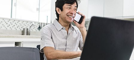 Smiling man working from home