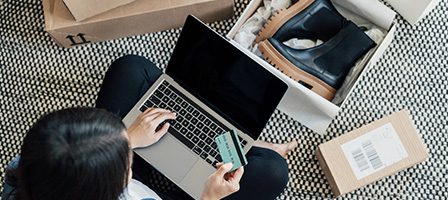 Person using laptop for online purchase