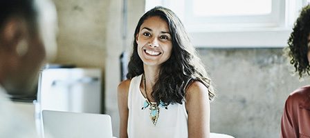 Cheerful woman in a white blouse