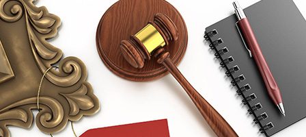 Gavel and notebook on desk