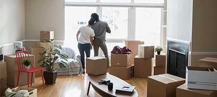 Couple unpacking in new home