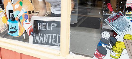Creative shop window with help sign