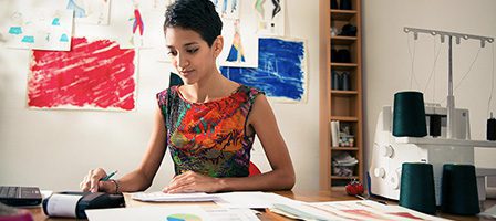 Designer focused on colorful project sketches