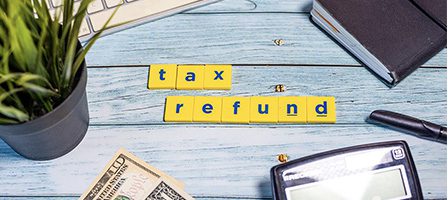 Tax refund concept with office supplies