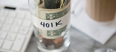401K savings jar with money