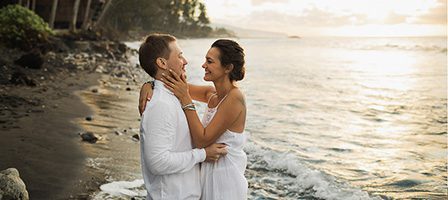Loving couple by the ocean waves