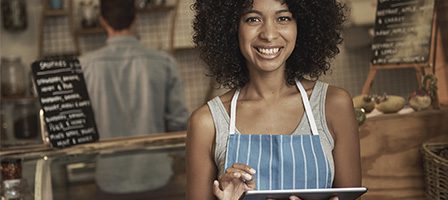 Barista smiling in a coffee shop