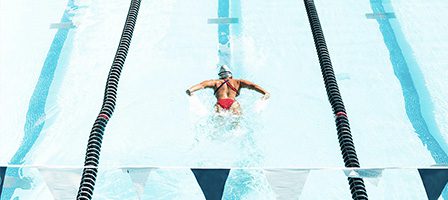 Athlete swimming butterfly stroke