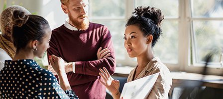 Group discussing in bright office