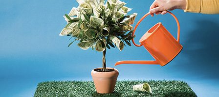 Financial growth concept with watering can