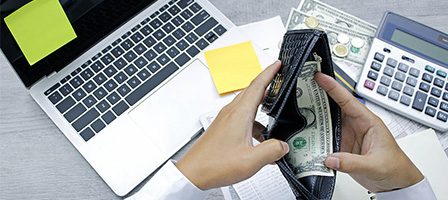 Calculator and cash on workspace table